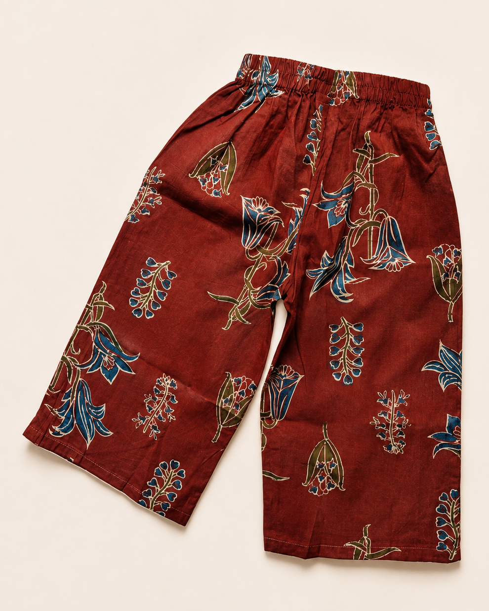 A floral printed girls premium cotton  flare pant from Aruvo, in rust colour