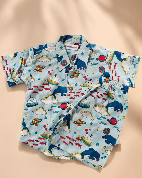 A pair of dolphin printed co-ord set from Aruvo is lying on beige background