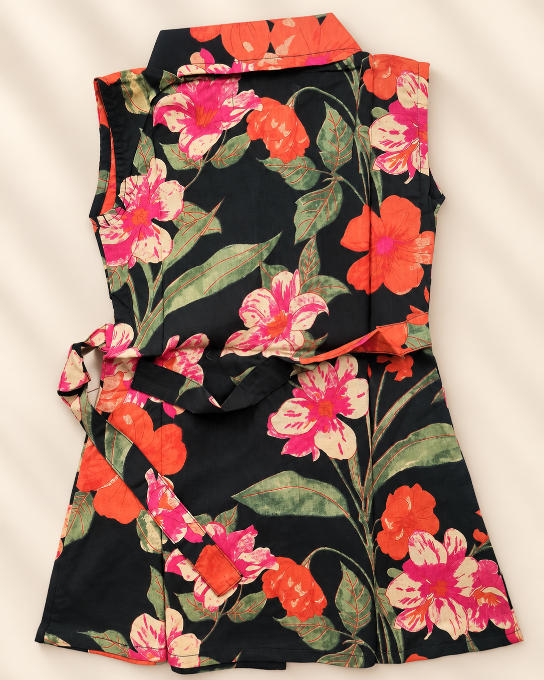 A dress in dark green color shows back side of the it, features a collared neck , laid on beige background