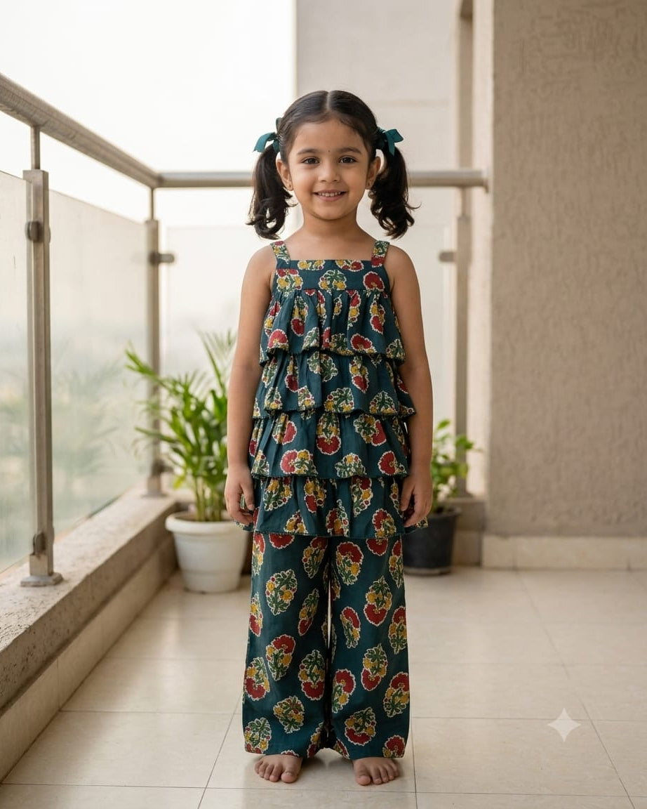 A young is wearing a layers top with matching pant crafted from 100%cotton, from Aruvo and is standing in a balcony