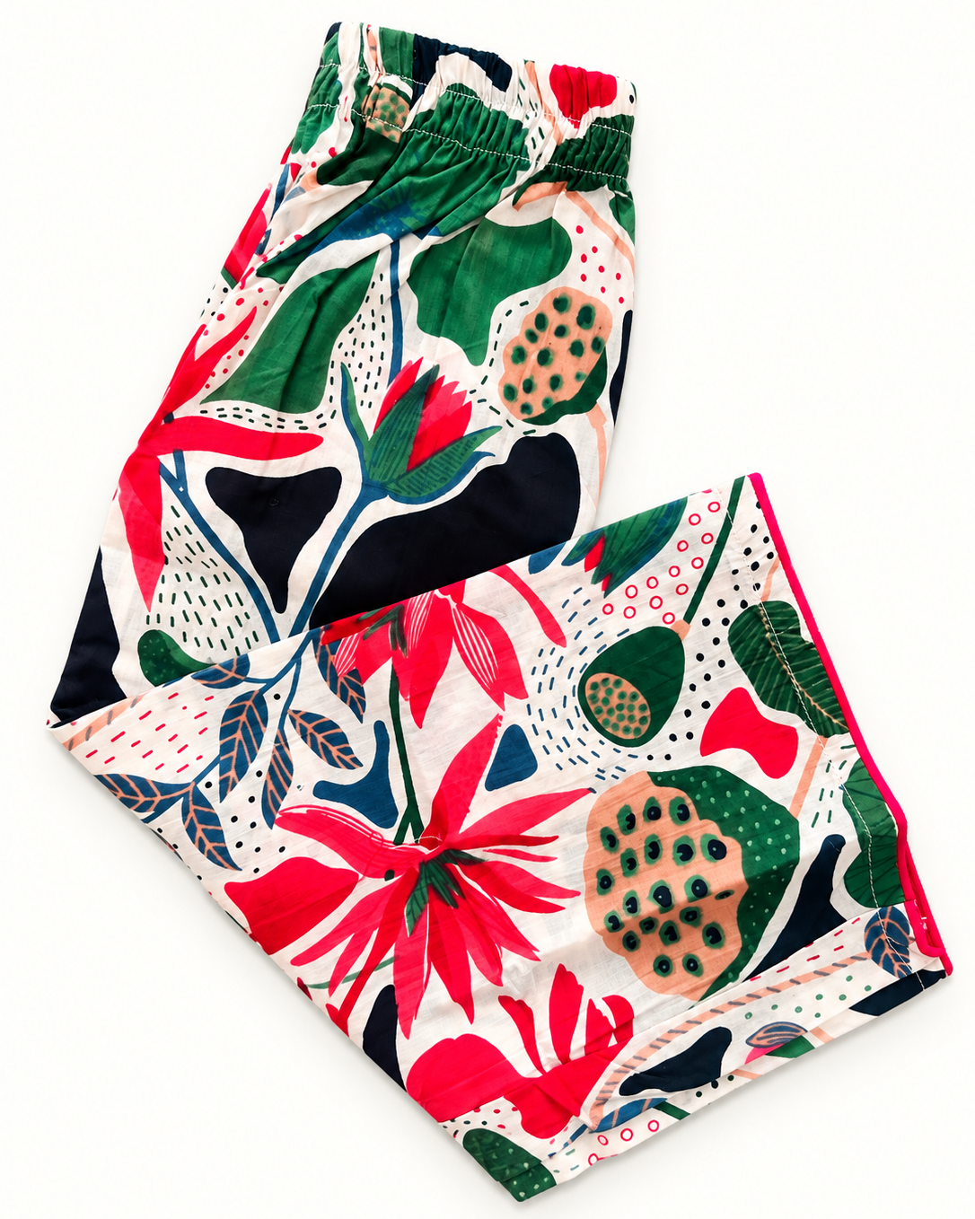 A Botanical printed pant from Aruvo is lying on the white background