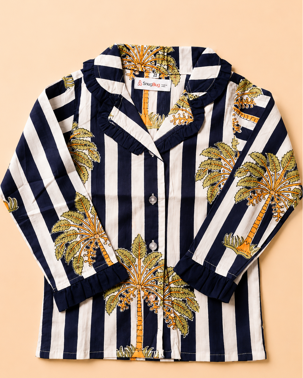 A striped Night Suit Shirt from Aruvo is laid off the floor