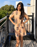 A girl wearing pure cotton Orange striped co-ord set from Aruvo