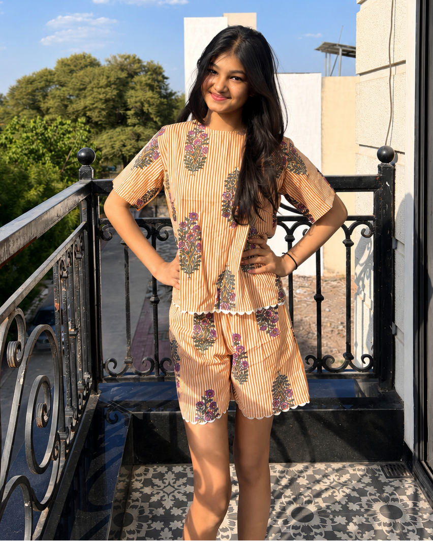 A girl wearing pure cotton Orange striped co-ord set from Aruvo