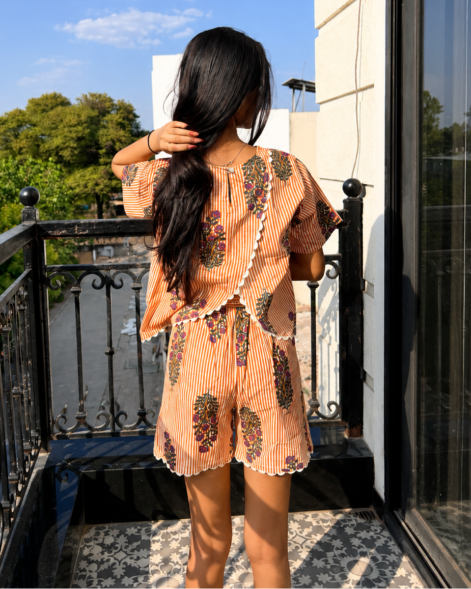 A girl wearing pure cotton Orange striped co-ord set from Aruvo