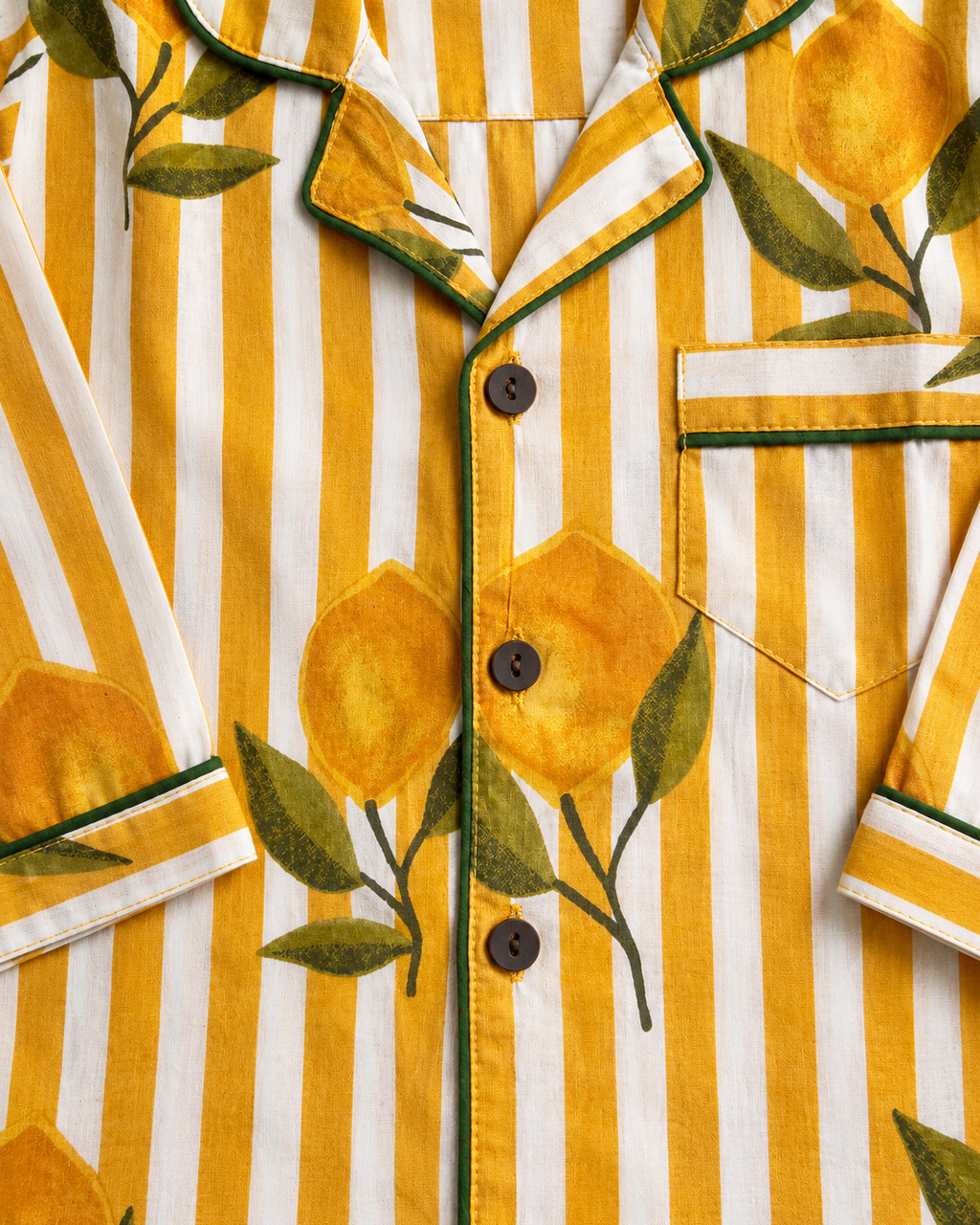 A premium full sleeve Yellow striped, floral printed kids night suit set from Aruvo