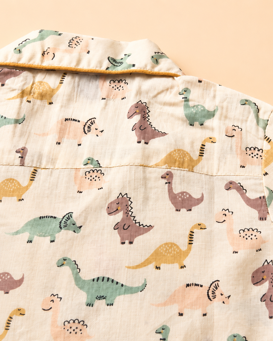 A close up look of the dianasore printed Night suit's shirt from Aruvo is laid off the floor
