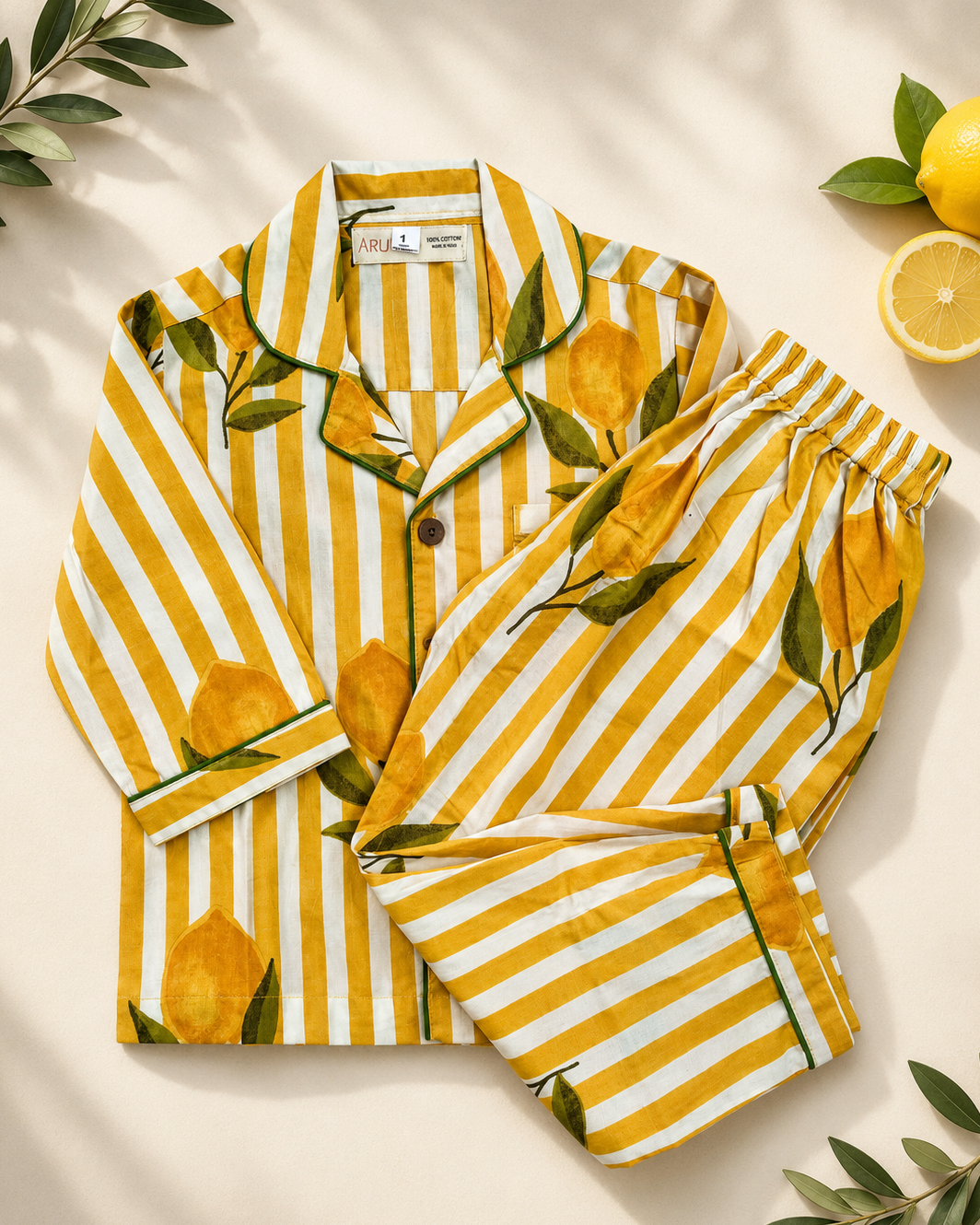 A premium full sleeve Yellow striped, floral printed kids night suit set from Aruvo